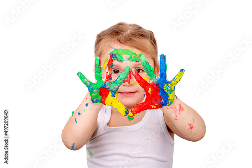 The girl shows her hands painted with bright colors  on a white background