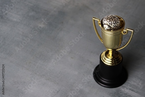 Принти на полотні Brain inside gold cup trophy with copy space