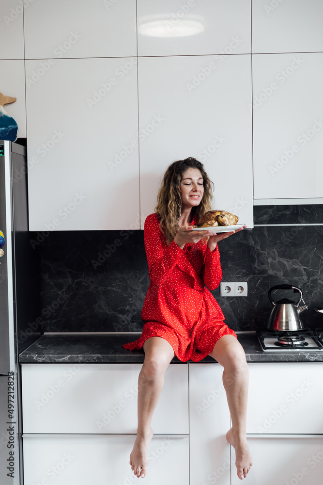 beautiful woman housewife cooking dinner in the kitchen beautiful woman housewife cooking dinner in the kitchen