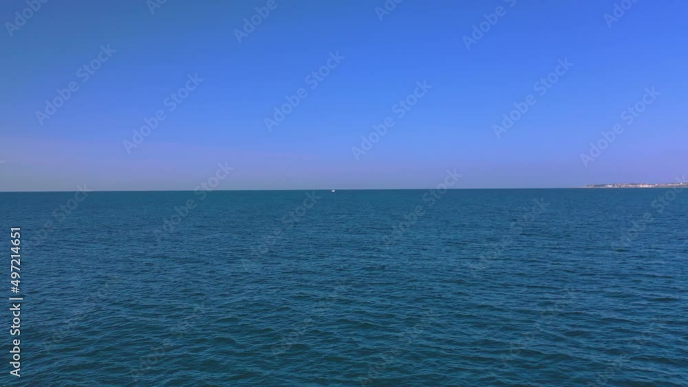 055_2_ojra.uas_Sea_FrontalTravelingView_towards the boat_SunnyDay_4k. Traveling frontally towards the ocean in search of a ship on a sunny day at sea. 055_2_ojra.uas_Sea_FrontalTravelingView_towards the boat_SunnyDay_4k. Traveling frontally towards the ocean in search of a ship on a sunny day at sea.