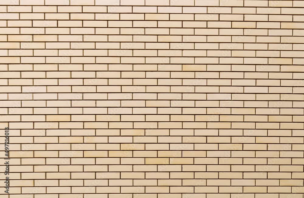The patternt from the brick wall yellow color The patternt from the brick wall yellow color