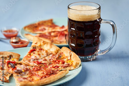 Dark beer and pizza