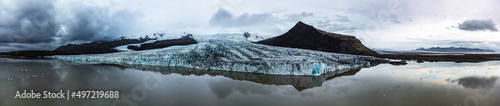 Glacier lake spectacular wide panorama with massive glaciar tongue photo