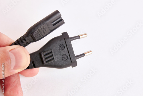 Power cord close up on white background.