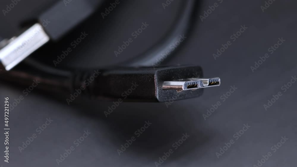 Hard disk ssd wire plug connector, black background macro shot close up view in 4k rotating motion. Hard disk ssd wire plug connector, black background macro shot close up view in 4k rotating motion.