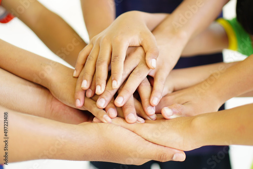 High five team work as a team together, air hands bless the power tag team. Multi-ethnic groups Unity together in the volunteer community. Cooperation Business team success concept.