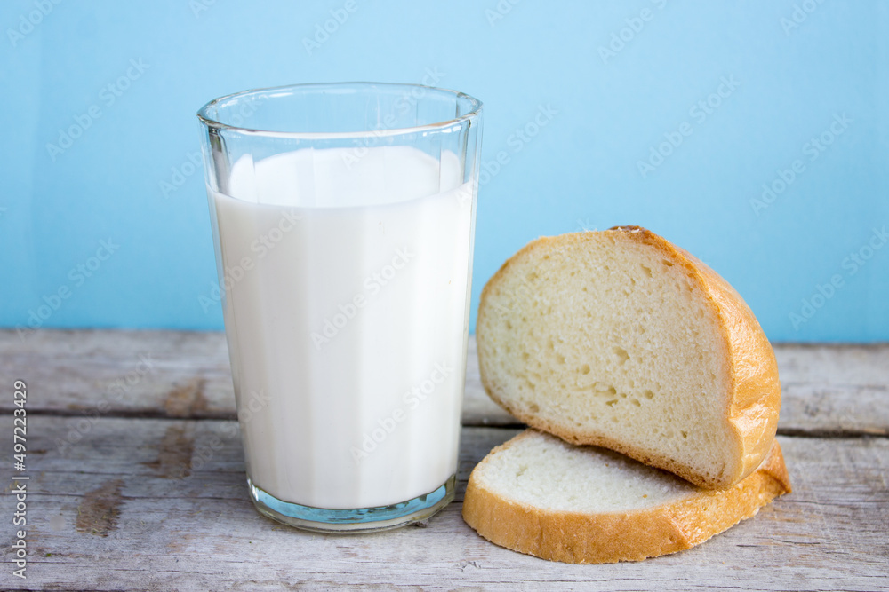 Glass of milk, Fresh milk and fragrant white bread Glass of milk, Fresh milk and fragrant white bread
