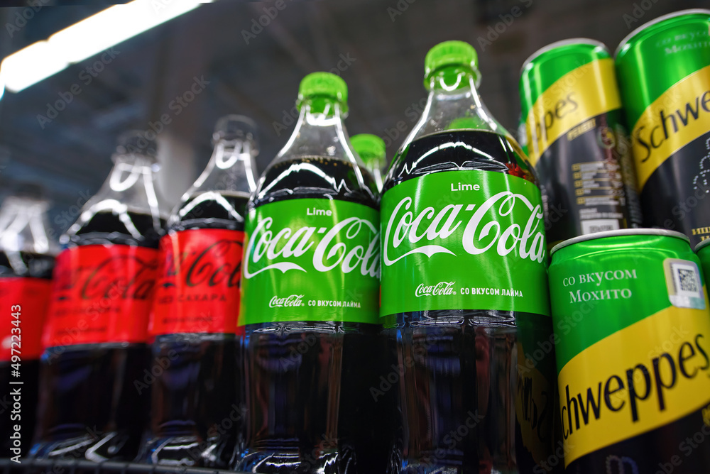 Minsk, Belarus. Apr 2022. Coca-cola Lime Bottles On Shelf And Cans With 