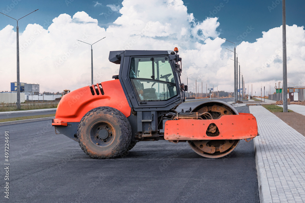 Heavy-duty vibratory roller for asphalt paving. Road construction. Construction of roads and urban transport communications. Heavy machinery. Heavy-duty vibratory roller for asphalt paving. Road construction. Construction of roads and urban transport communications. Heavy machinery.