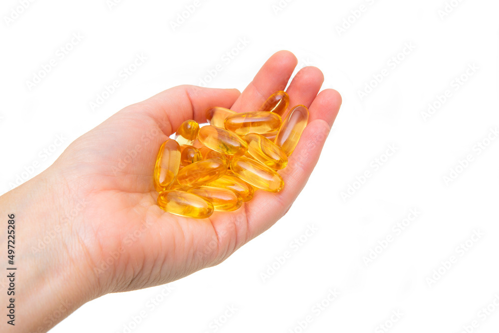 Handful of fish oil softgels isolated on white Handful of fish oil softgels isolated on white
