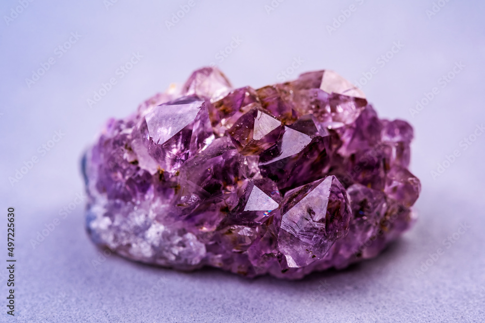 Amethyst cluster, quartz crystal on pink background. Crystals for esoteric practice, recreation and meditation. Amethyst cluster, quartz crystal on pink background. Crystals for esoteric practice, recreation and meditation.