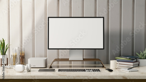 Stylish white workspace with pc computer mockup on marble table against white wall.