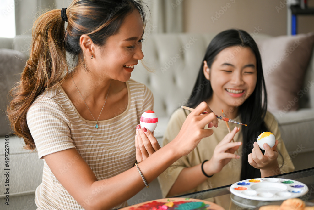 A beautiful asian woman enjoy prepare an Easter eggs with her younger sister. A beautiful asian woman enjoy prepare an Easter eggs with her younger sister.