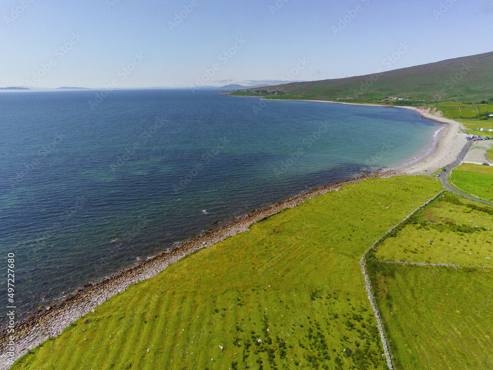 Cost line of Ireland and Mulranny beach in county Mayo, Ireland. Warm sunny day. Aerial drone view. Irish landscape. Vast green fields and hill.