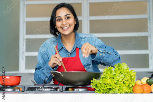 Mature latin american woman preparing vegetarian food