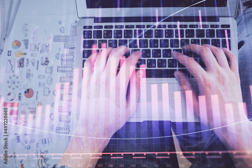 Double exposure of man's hands typing over laptop keyboard and forex chart hologram drawing. Top view. Financial markets concept. Double exposure of man's hands typing over laptop keyboard and forex chart hologram drawing. Top view. Financial markets concept.