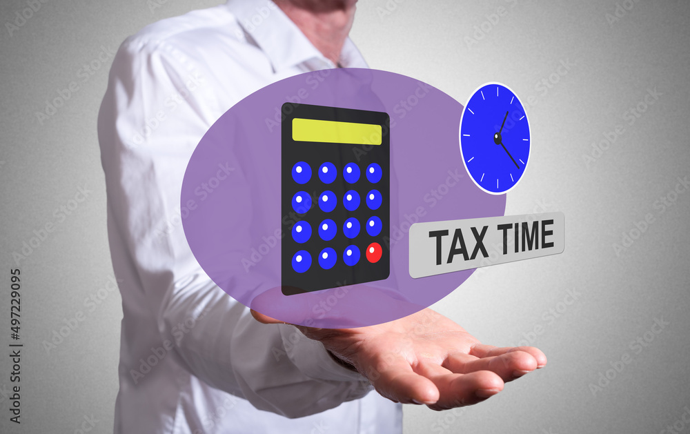Tax time concept above a human hand Tax time concept above a human hand