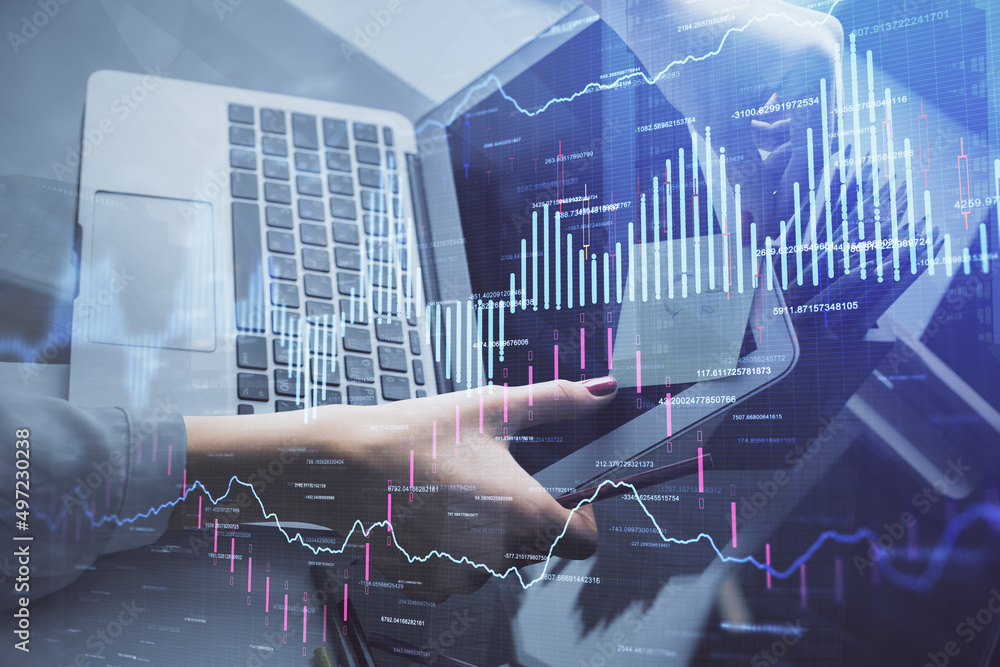 Double exposure of businesswoman hands typing on computer and financial graph hologram drawing. Stock market analysis concept. Double exposure of businesswoman hands typing on computer and financial graph hologram drawing. Stock market analysis concept.