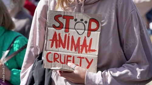 animal rights. Stop Animal Abuse. Vegans are against eating animals. Animal advocates against animal testing of cosmetics. Demonstration march crowd photo