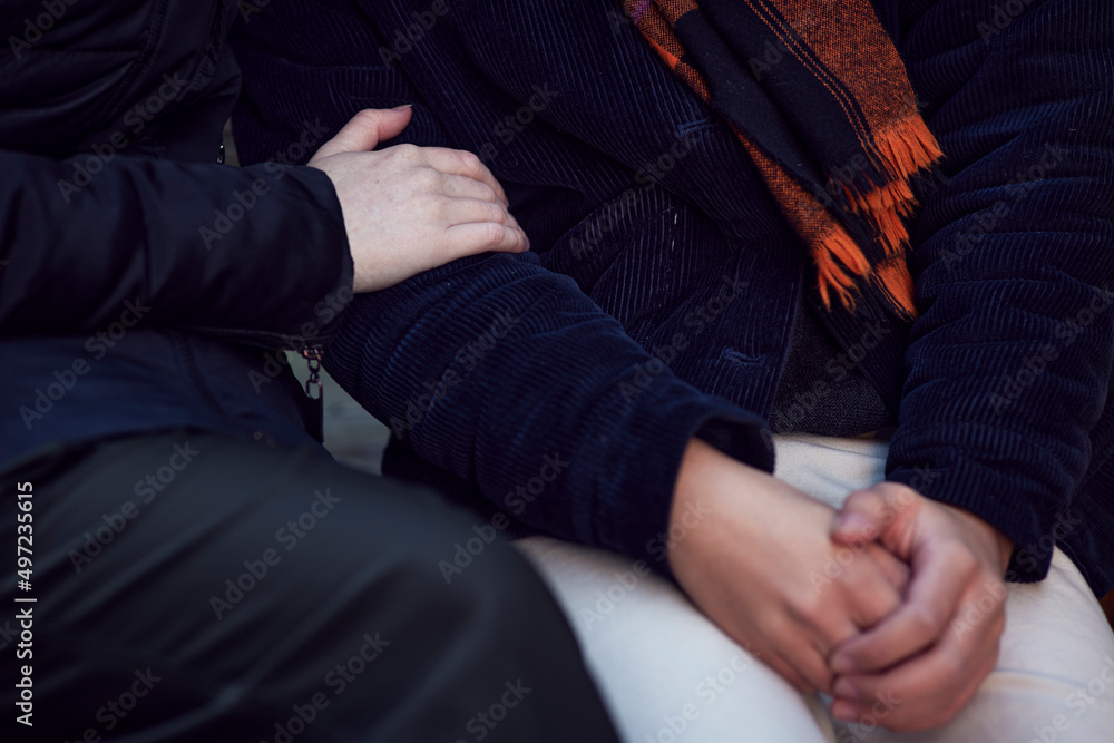 Hands of people comforting each other Hands of people comforting each other