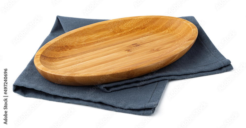 Wooden plate and tablecloth on white background Wooden plate and tablecloth on white background