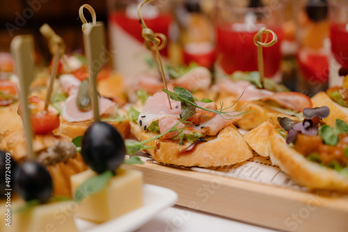 Cheese canapes with wine on table. Catering.