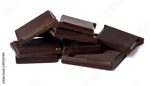 Small dark chocolate pieces isolated on white background