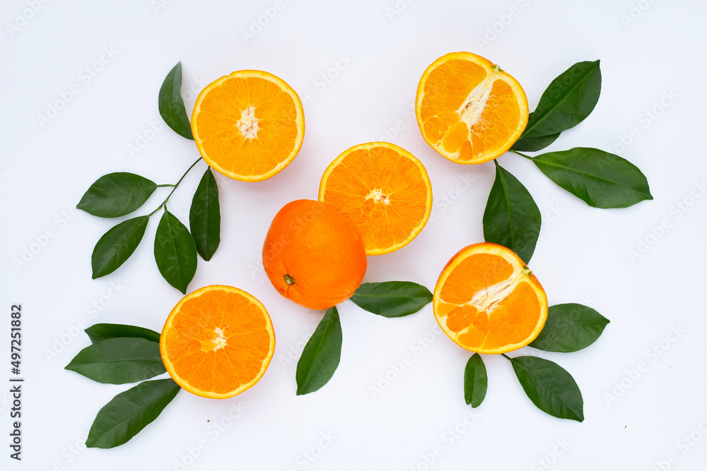 Orange fruit with green leaves on white background. Orange fruit with green leaves on white background.