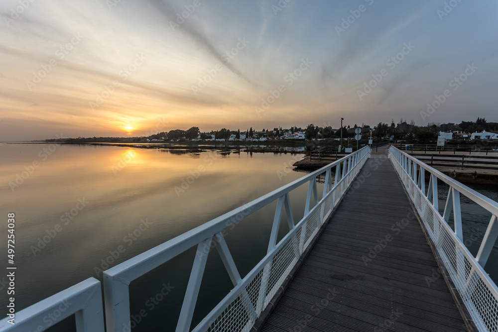 sunset over a footbridge at the seaside, seascape, landscape