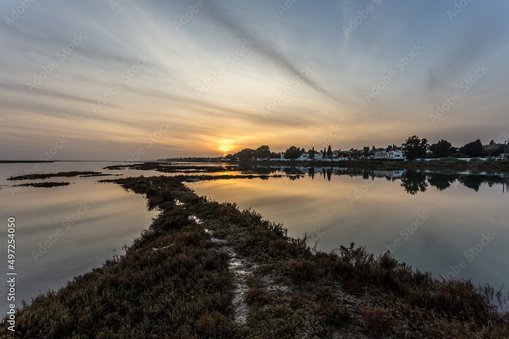 sunset on the beach and a footpath,  landscape