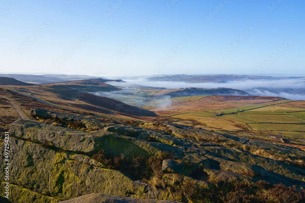 From the gritstone slopes of Stanage Edge, across a misty Derbyshire.