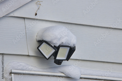 Closeup of the outdoor lamps covered with snow. photo