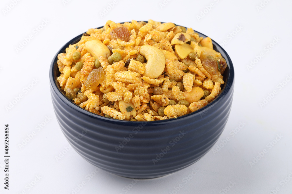 Indian Namkeen Snacks served in ceramic bowl & plate OR Indian traditional Namkeen Food Navratan Mixture or Navratna Mix Namkeen Also Know as Nimco, Namkin, Mixture or Nimko Indian Namkeen Snacks served in ceramic bowl & plate OR Indian traditional Namkeen Food Navratan Mixture or Navratna Mix Namkeen Also Know as Nimco, Namkin, Mixture or Nimko