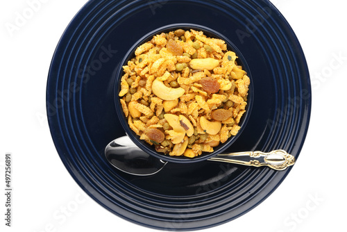 Indian Namkeen Snacks served in ceramic bowl & plate OR Indian traditional Namkeen Food Navratan Mixture or Navratna Mix Namkeen Also Know as Nimco, Namkin, Mixture or Nimko photo