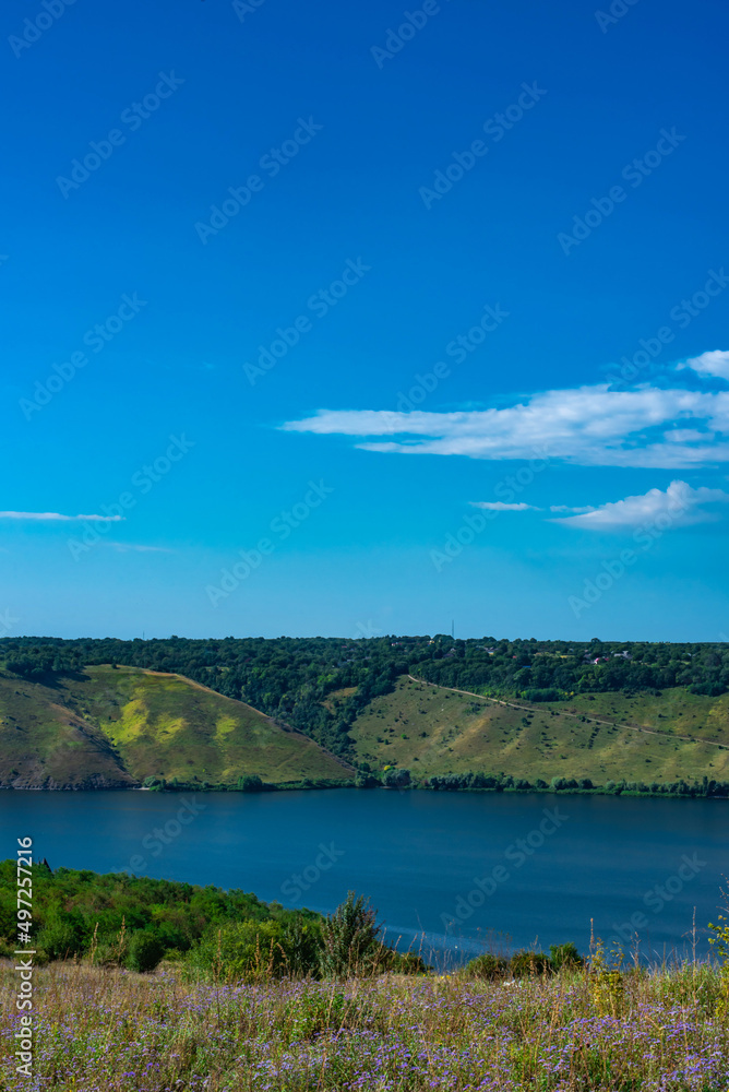 Landscape of beautiful River Dnister with Rocky Mountains in Bakota, Ukraine. Summer Travel serene minimalistic view . 