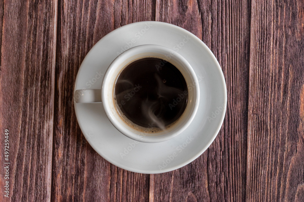 cup of coffee on wooden table
