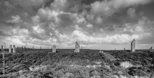 Grayscale shot of Brodgar Stone Circle in Orkney, Scotland with cloudy sky photo