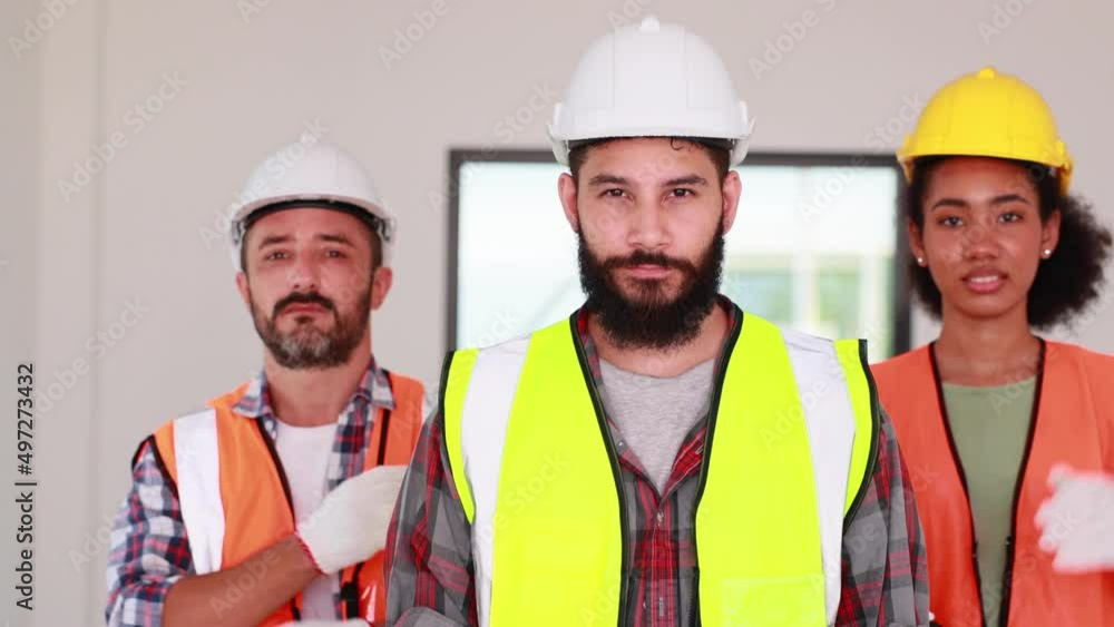 Professional confident Mechanical civil Engineer and construction team at house project underconstruction site. Group portrait. Unity and teamwork concept. Look at camera Professional confident Mechanical civil Engineer and construction team at house project underconstruction site. Group portrait. Unity and teamwork concept. Look at camera