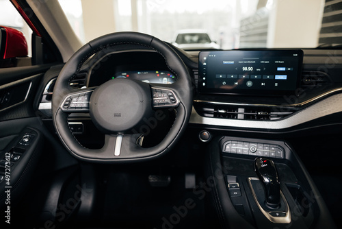 Interior view of car, luxury car steering wheel and dashboard