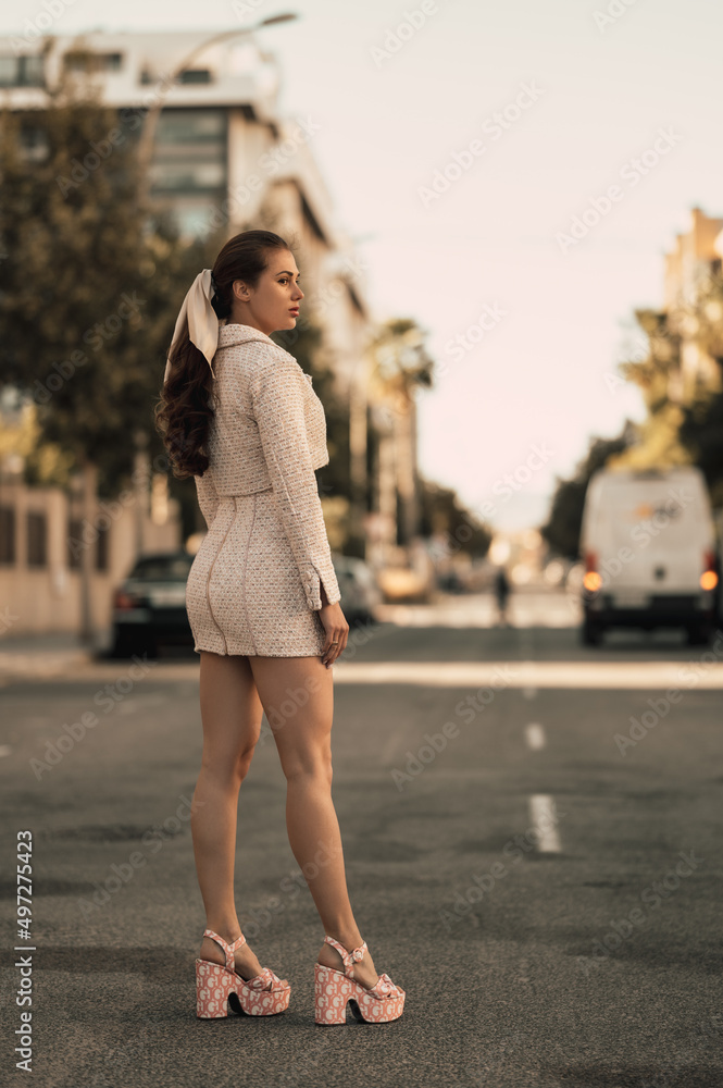 Fashion style model girl posing outside.