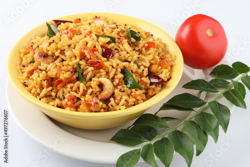 Tomato rice.spicy South Indian rice recipe Tomato pulao or Tomato Rice ,South Indian Thakkali Sadam ,Tomato Bath an Indian vegetarian dish. Healthy nutritious photo