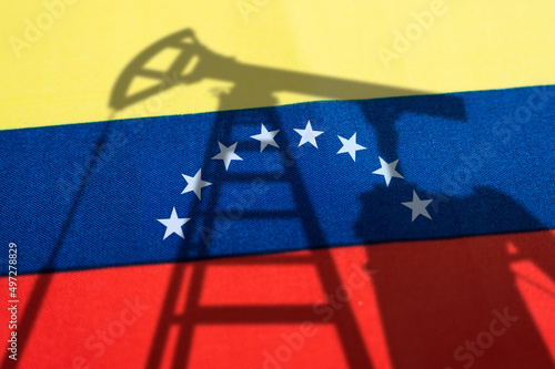 oil industry of venezuela . Oil rigs on the background of the venezuelan flag. Mining and oil export. trading on global fuel market. Fuel industry concept.