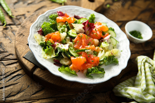 Healthy vegetable salad with smoked salmon
