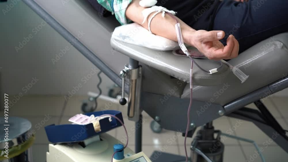 world blood donor day, blood sampling from a man, close-up, nurse and patient world blood donor day, blood sampling from a man, close-up, nurse and patient