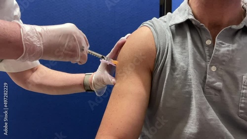 Close up of man receiving his COVID-19 vaccine