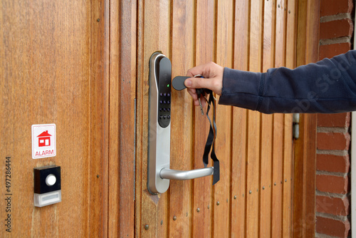 Fotografie Opening a residential door with electronic key fob