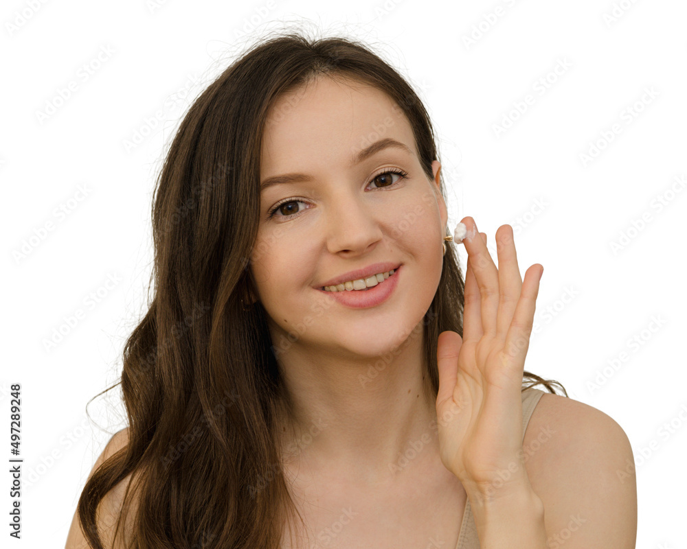 young woman brunette applying a moisturizing cream young woman brunette applying a moisturizing cream
