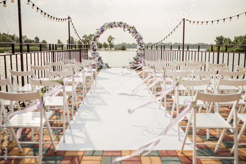 beautiful arch at an outdoor ceremony, in anticipation of the newlyweds, wedding decorations