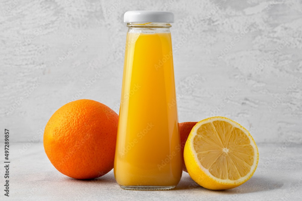 Orange fruit and orange juice on wooden background Orange fruit and orange juice on wooden background