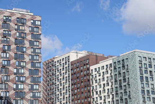 Photography Colorful urban residential buildings with a clear blue sky in a residential area